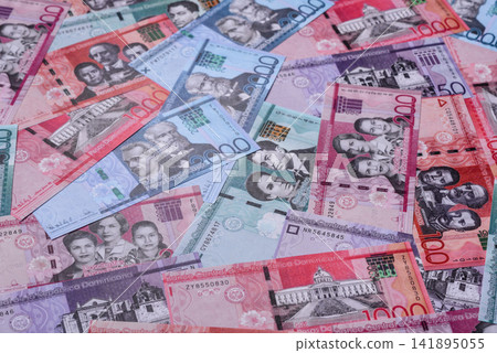 Dominican peso banknotes and coins as a instrument of trade and exchange. Dominican peso Dominican peso banknotes and coins as a instrument of trade and exchange. Dominican peso 141895055