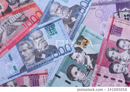 Dominican peso banknotes and coins as a instrument of trade and exchange. Dominican peso Dominican peso banknotes and coins as a instrument of trade and exchange. Dominican peso 141895058