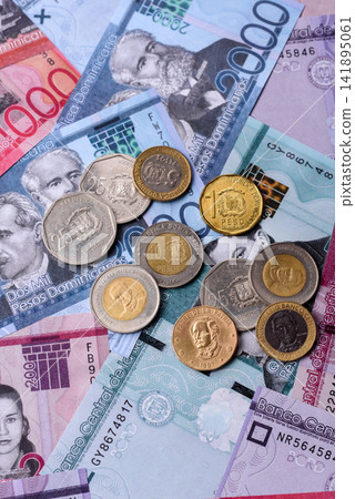 Dominican peso banknotes and coins as a instrument of trade and exchange. Dominican peso Dominican peso banknotes and coins as a instrument of trade and exchange. Dominican peso 141895061