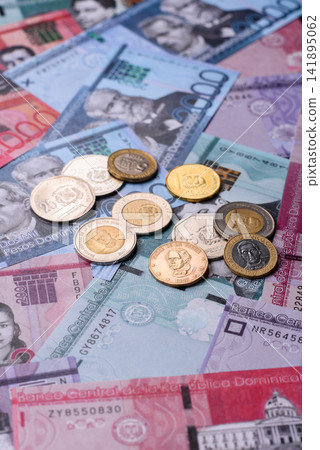 Dominican peso banknotes and coins as a instrument of trade and exchange. Dominican peso Dominican peso banknotes and coins as a instrument of trade and exchange. Dominican peso 141895062