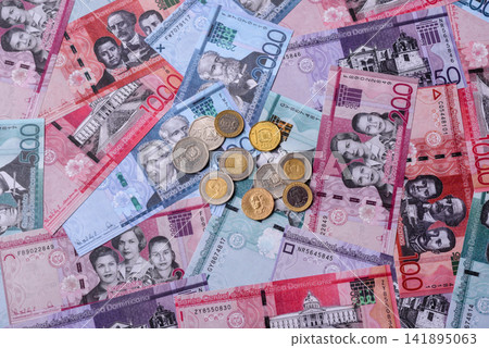 Dominican peso banknotes and coins as a instrument of trade and exchange. Dominican peso Dominican peso banknotes and coins as a instrument of trade and exchange. Dominican peso 141895063