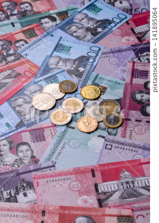 Dominican peso banknotes and coins as a instrument of trade and exchange. Dominican peso Dominican peso banknotes and coins as a instrument of trade and exchange. Dominican peso 141895064
