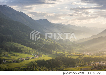 Scenic aerial view of picturesque valley and mountains in St Johann im Pongau region Scenic aerial view of picturesque valley and mountains in St Johann im Pongau region 141895549