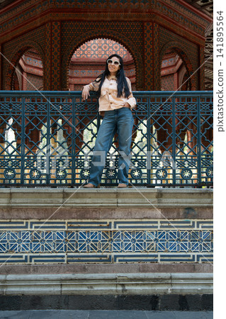 Woman posing at kiosco morisco in mexico city Woman posing at kiosco morisco in mexico city 141895564
