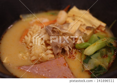 Steaming Bowl of Flavorful Asian Soup Steaming Bowl of Flavorful Asian Soup 141896511