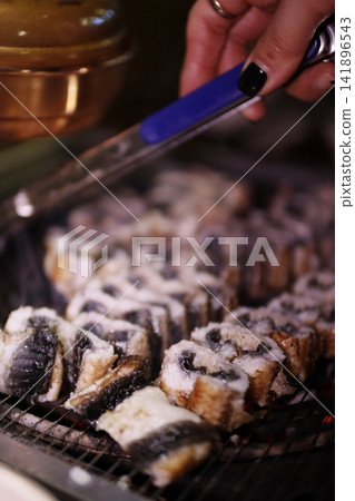 Grilled Food on Grill with Tongs Grilled Food on Grill with Tongs 141896543