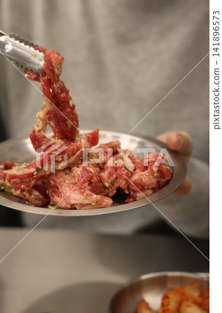 Marinated Raw Beef Slices Being Prepared Marinated Raw Beef Slices Being Prepared 141896573