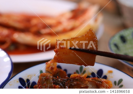 Kimchi and Fried Rice with Chopsticks Close-up Kimchi and Fried Rice with Chopsticks Close-up 141896658