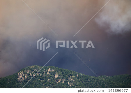 Wildfire Smoke Rising Behind the Hills Wildfire Smoke Rising Behind the Hills 141896977