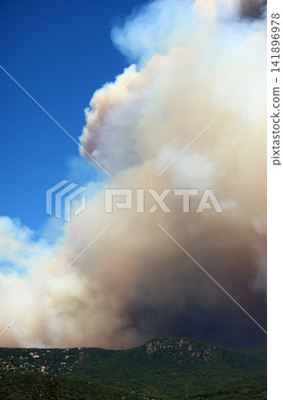 Wildfire Smoke Rising Behind the Hills Wildfire Smoke Rising Behind the Hills 141896978