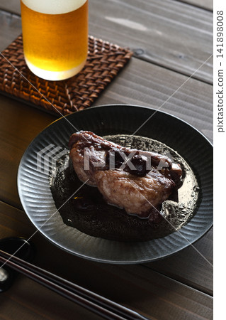Pork spare ribs braised in blueberry jam Pork spare ribs braised in blueberry jam 141898008