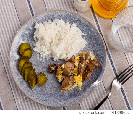 Fried omelette with rabbit liver, boiled rice and pickled cucumber Fried omelette with rabbit liver, boiled rice and pickled cucumber 141898602