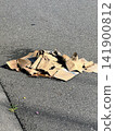 Water-soaked cardboard boxes left on the street 141900812
