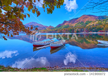A view of Lake Haruna and the autumn-colored mountains (including Mt. Bingushi and Mt. Kamonogatake) from near Haruna Lake Onsen in Takasaki City, Gunma Prefecture, during autumn. A view of Lake Haruna and the autumn-colored mountains (including Mt. Bingushi and Mt. Kamonogatake) from near Haruna Lake Onsen in Takasaki City, Gunma Prefecture, during autumn. 141900872