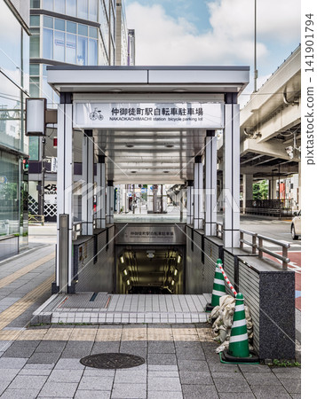 Entrance to the Naka-Okachimachi Station bicycle parking area; stairs leading to the underground bicycle parking area. Entrance to the Naka-Okachimachi Station bicycle parking area; stairs leading to the underground bicycle parking area. 141901794