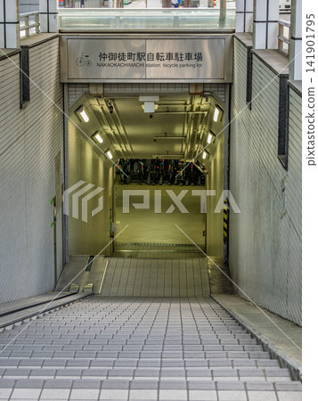 Naka-Okachimachi Station Bicycle Parking: Entrance leading to the underground and bicycle transport facilities Naka-Okachimachi Station Bicycle Parking: Entrance leading to the underground and bicycle transport facilities 141901795