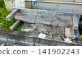 An old wooden bench lying on its side. 141902243
