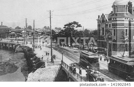 Old photograph, 1918-1933, Fukuoka City: Daido Life Insurance Kyushu Branch and Nishi-Ohashi Bridge viewed from the Fukuoka Prefectural Products Exhibition Hall across Tenjin Bridge. Old photograph, 1918-1933, Fukuoka City: Daido Life Insurance Kyushu Branch and Nishi-Ohashi Bridge viewed from the Fukuoka Prefectural Products Exhibition Hall across Tenjin Bridge. 141902845