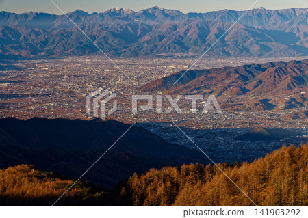 The Southern Alps mountain range and the Kofu Basin as seen from the Daibosatsu Pass ridge in late autumn. The Southern Alps mountain range and the Kofu Basin as seen from the Daibosatsu Pass ridge in late autumn. 141903292