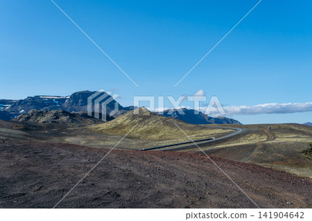 Scenic ring road winding through volcanic landscape in Iceland 141904642
