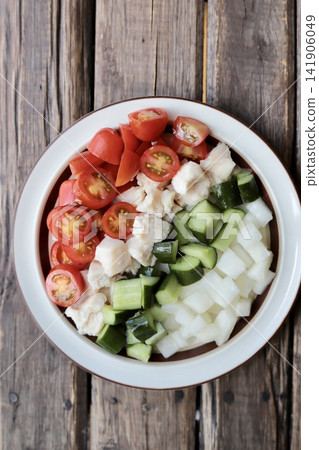 A small, single-serving Cobb salad-style chicken salad. A small, single-serving Cobb salad-style chicken salad. 141906049