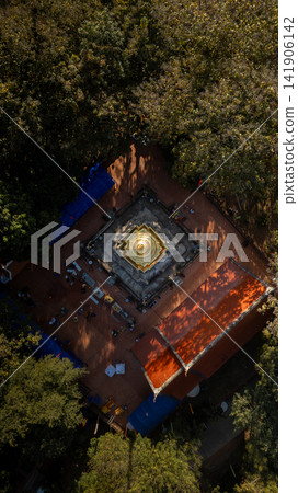 A top down aerial view of Wat Phra That Chom Kitti in Chiang Rai. The square tiered pagoda base rests on red brick courtyard tiles on 13 January 2023. A top down aerial view of Wat Phra That Chom Kitti in Chiang Rai. The square tiered pagoda base rests on red brick courtyard tiles on 13 January 2023. 141906142