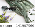 sunglasses, green scarf of lifestyle woman relax summer with purple flowers  141907560