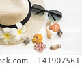 hat, sunglasses of lifestyle woman relax summer season with shellfhish 141907561