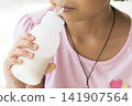 children girl holding milks bottle drinks for health care happy 141907564