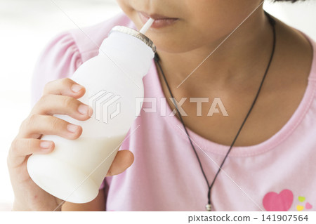 children girl holding milks bottle drinks for health care happy children girl holding milks bottle drinks for health care happy 141907564