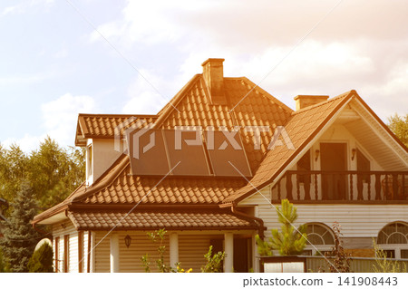 Solar power energy on the roof to a standard house. Solar power panels ,Photovoltaic modules for innovation green energy for life with blue sky background. High quality photo Solar power energy on the roof to a standard house. Solar power panels ,Photovoltaic modules for innovation green energy for life with blue sky background. High quality photo 141908443
