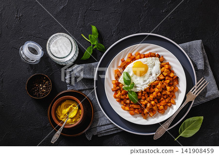 Diced fried potatoes cooked with cubed sausage Diced fried potatoes cooked with cubed sausage 141908459