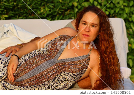 Pregnant Woman Enjoying a Peaceful Outdoor Moment Pregnant Woman Enjoying a Peaceful Outdoor Moment 141908501