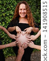 Pregnant Woman Enjoying a Peaceful Outdoor Moment 141908515