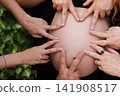 Pregnant Woman Enjoying a Peaceful Outdoor Moment 141908517