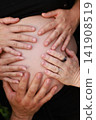 Pregnant Woman Enjoying a Peaceful Outdoor Moment 141908519