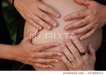 Pregnant Woman Enjoying a Peaceful Outdoor Moment Pregnant Woman Enjoying a Peaceful Outdoor Moment 141908521