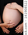 Pregnant Woman Enjoying a Peaceful Outdoor Moment 141908522
