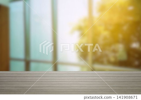 Wooden table top with blurred window and sunlight interior background for professional product presentation. Wooden table top with blurred window and sunlight interior background for professional product presentation. 141908671