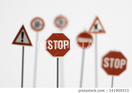 Miniature stop sign on white background 141909353