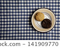 Cookies on a blue and white checkered tablecloth 141909770