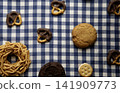 Delicious cookies on a blue and white checkered tablecloth 141909773