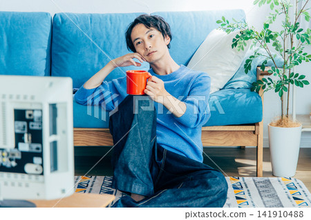 Young man relaxing at home Young man relaxing at home 141910488
