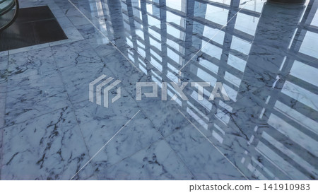 Hong Kong Aug 7 2026 skyscraper reflections on a polished marble floor Hong Kong Aug 7 2026 skyscraper reflections on a polished marble floor 141910983