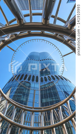 Hong Kong Aug 7 2026 Henderson skyscraper framed through a circular metallic Hong Kong Aug 7 2026 Henderson skyscraper framed through a circular metallic 141910993