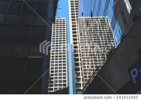 Hong Kong Aug 7 2026 Glass facade reflection and highrise towers in Central Hong Kong Aug 7 2026 Glass facade reflection and highrise towers in Central 141911050