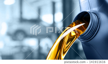 Pouring motor oil into the car engine Pouring motor oil into the car engine 141911616