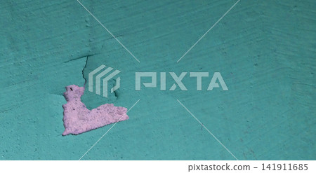 Turquoise-painted wall with peeling plaster and cracks. Turquoise-painted wall with peeling plaster and cracks. 141911685