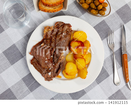 Appetizing beef with potatoes Appetizing beef with potatoes 141912115