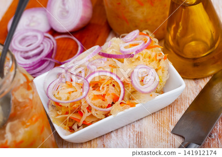 Traditional Russian salted cabbage sauerkraut with onion Traditional Russian salted cabbage sauerkraut with onion 141912174